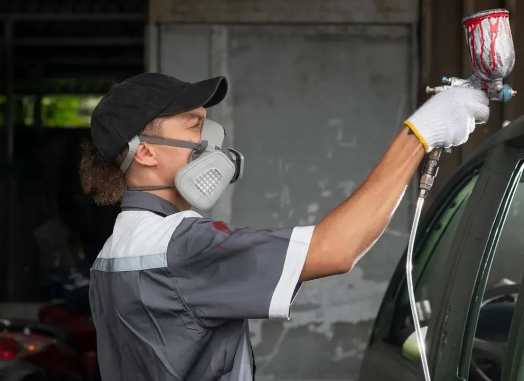 Painter wearing respirator mask.