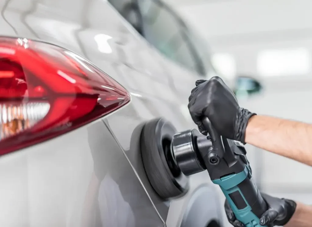 Polishing a car exterior.