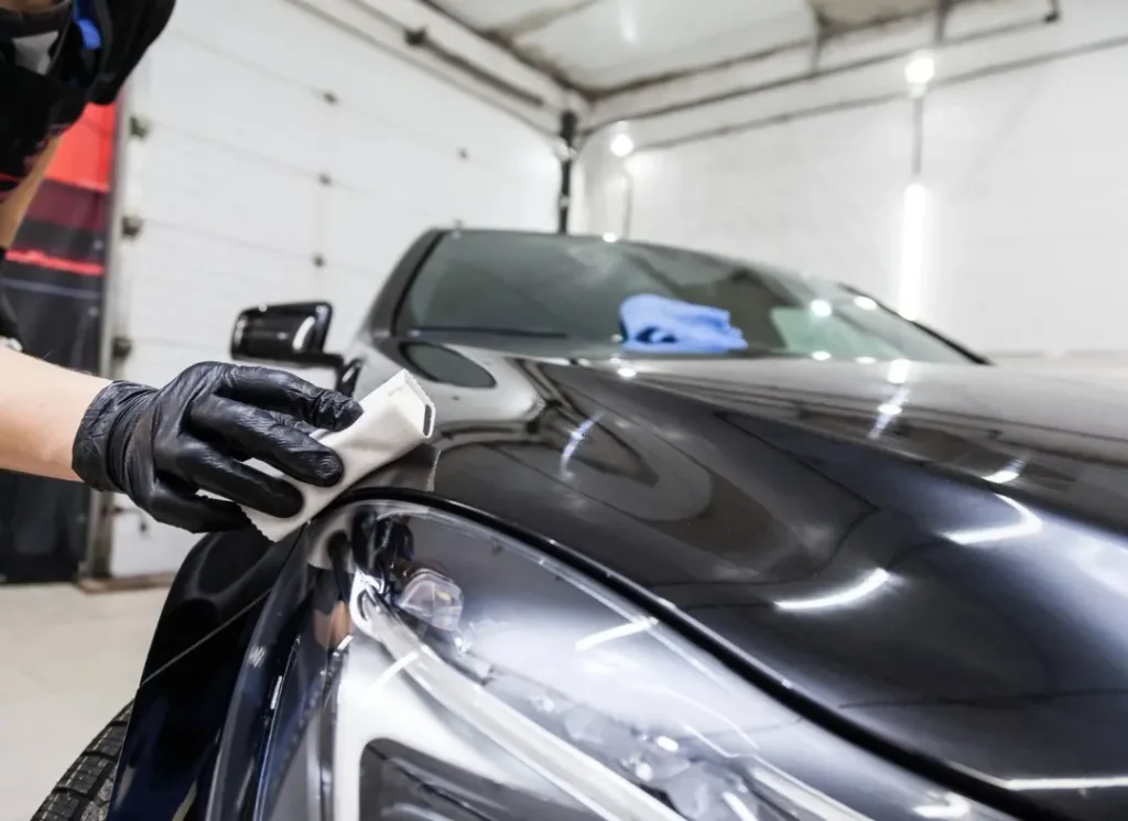 Applying car ceramic coating.